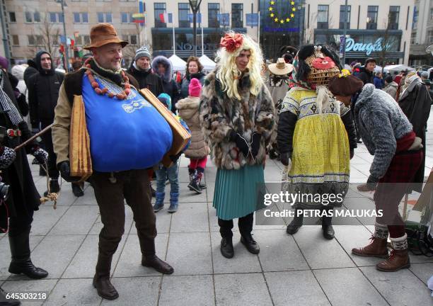 Revellers parade through the streets of the old town of Vilnius to celebrate Uzgavenes or 'the time before lent' on February 25, 2017. 'Uzgavenes' is...