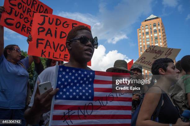 Protesters at a rally honoring Trayvon Martin at Union Square in Manhattan in New York City. George Zimmerman was acquitted of all charges in the...