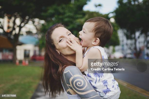 Woman and her son having fun in a city park