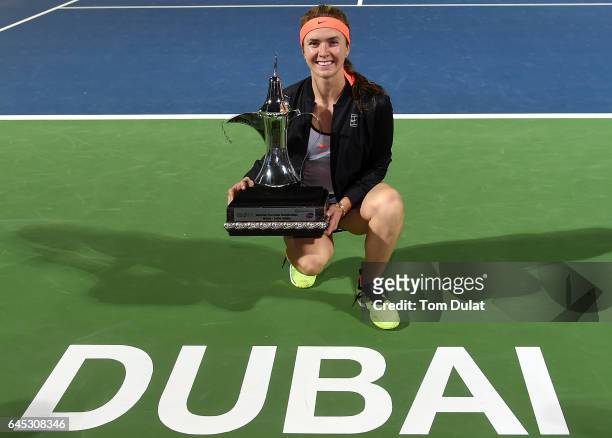 Elina Svitolina of Ukraine poses with the trophy after winning the final match against Caroline Woznacki of Denmark on day seven of the WTA Dubai...