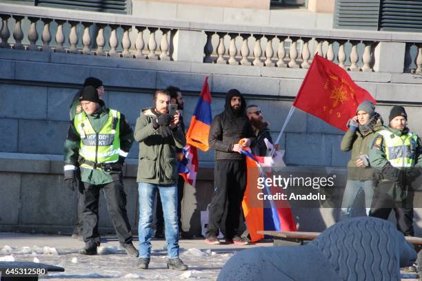 Group of Armenian-Swedish people try to intervene in to the people who stage a rally on the 25th anniversary of the Khojaly Massacre, in front the...