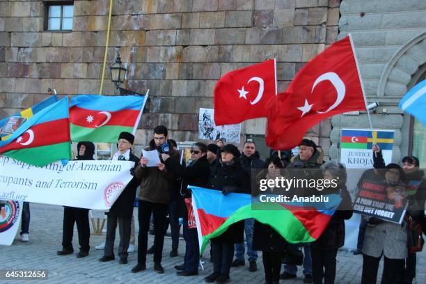 People attend a rally on the 25th anniversary of the Khojaly Massacre, in front the Parliament building in Stockholm, Sweden on February 25, 2017....