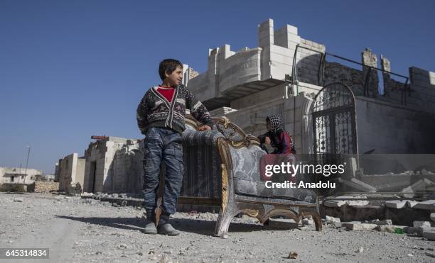 Civilians are seen in the Syrian town of Al Bab after the town center has been entirely freed from Daesh terrorists by Free Syrian Army , backed by...