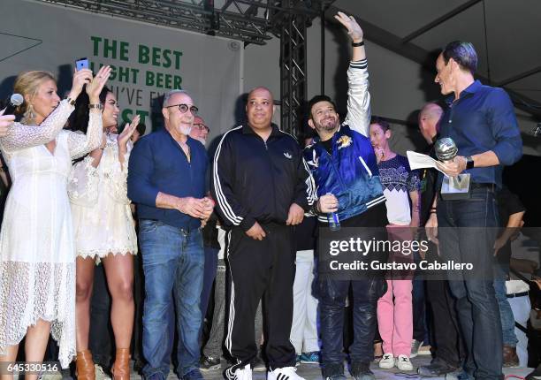 Judges Jill Martin, Ayesha Curry, Emilio Estefan, Rev Run, Adam Richman, David Bromstad, and Randy Fisher on stage at Heineken Light Burger Bash...