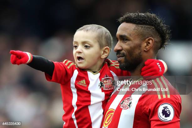 Sunderland mascot Bradley Lowery points to the crowd as Jermaine Defoe looks on ahead of during the Premier League match between Everton and...