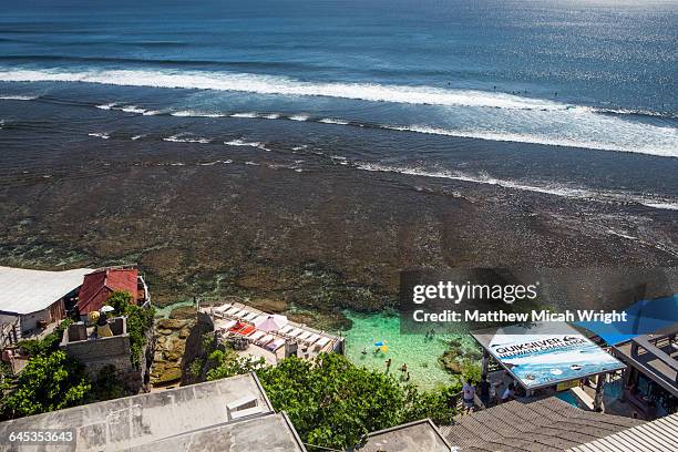 views overlooking the famous surf beach, uluwatu. - uluwatu stock pictures, royalty-free photos & images