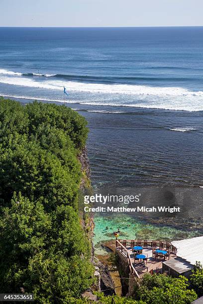 views overlooking the famous surf beach, uluwatu. - uluwatu stock pictures, royalty-free photos & images