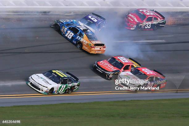 Darrell Wallace Jr, driver of the Leidos Ford, and Daniel Suarez, driver of the Juniper Toyota, are involved in an on-track incident during the...