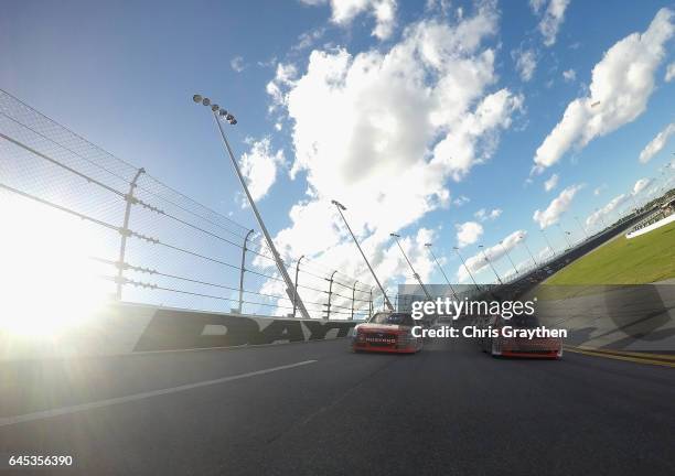 Ryan Reed, driver of the Lilly Diabetes Ford, and Brandon Jones, driver of the Nexteer Automotive Chevrolet, lead the field prior to the start of the...