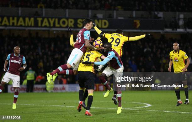 West Ham United's Cheikhou Kouyate and Jose Fonte challenge Watford's Craig Cathcart and Etienne Capoue during the Premier League match between...