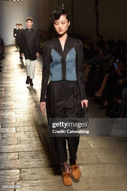 Model walks the runway at the Bottega Veneta Autumn Winter 2017 fashion show during Milan Fashion Week on February 25, 2017 in Milan, Italy.