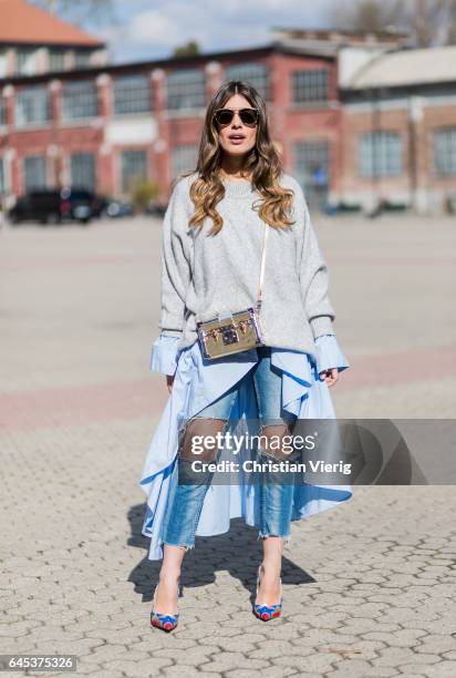 Aida Domenech wearing a grey knit, ripped denim jeans outside Missoni during Milan Fashion Week Fall/Winter 2017/18 on February 25, 2017 in Milan,...