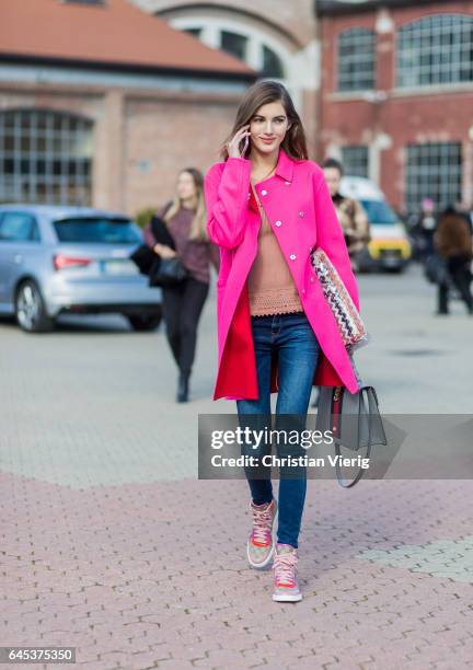 Model Valery Kaufman wearing a pink coat, Gucci bag and Gucci sneakers outside Missoni during Milan Fashion Week Fall/Winter 2017/18 on February 25,...