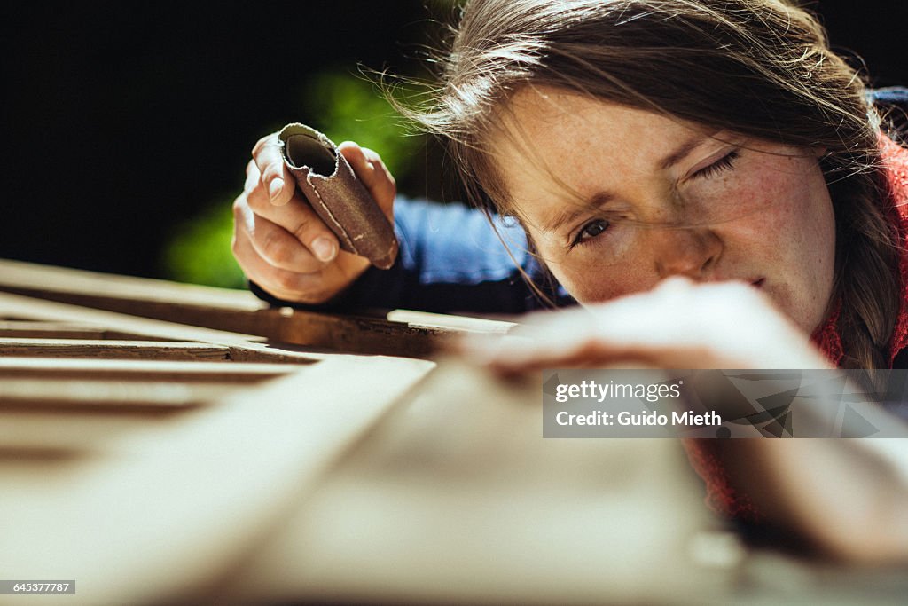 Woman checking her work.