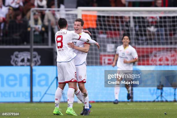 Levin Mete Oeztunali of Mainz celebrates with Gaetan Bussmann after scoring his team's second goal during the Bundesliga match between Bayer 04...