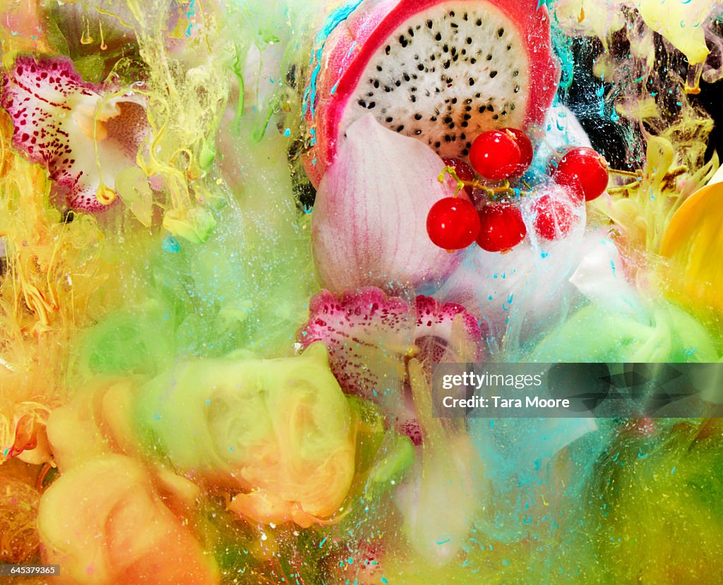 Fruit, flowers and paint in water