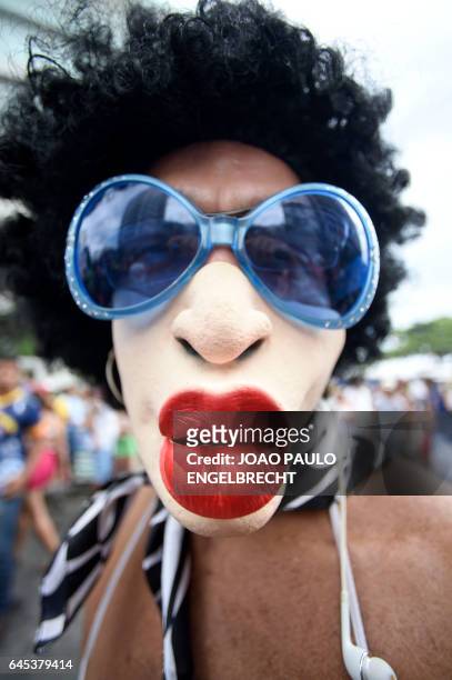 Reveller takes part in the 'Banda de Ipanema' traditional carnival band parade in the beach of Ipanema in Rio de Janeiro, Brazil, on February 25,...