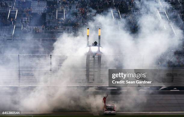 Ryan Reed, driver of the Lilly Diabetes Ford, celebrates winning the NASCAR XFINITY Series PowerShares QQQ 300 at Daytona International Speedway on...