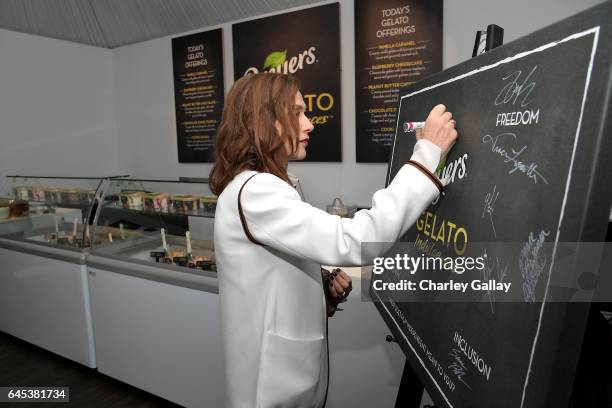Actress Isabelle Huppert stops by the Breyers® Gelato Indulgences gelateria backstage at the 32nd Annual Film Independent Spirit Awards sponsored by...