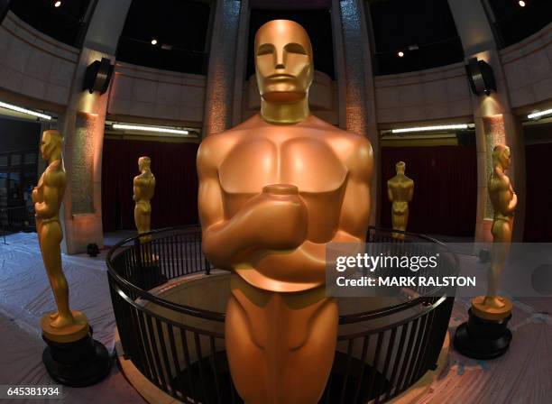 An Oscars statue stands at the end of the red carpet arrivals area ahead of the 89th annual Oscars at the Dolby Theater in Hollywood, California on...