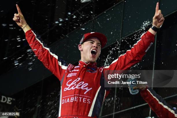 Ryan Reed, driver of the Lilly Diabetes Ford, celebrates in Victory Lane after winning the NASCAR XFINITY Series PowerShares QQQ 300 at Daytona...