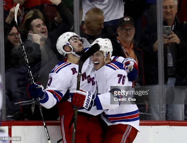Mika Zibanejad of the New York Rangers celebrates his game winning goal with teammate Brady Skjei in overime against the New Jersey Devils on...
