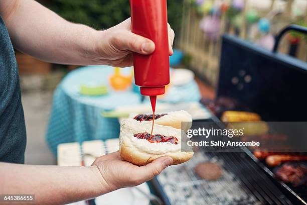 family barbecue - tomato ketchup stock pictures, royalty-free photos & images