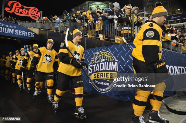 Justin Schultz, Steve Oleksy, Chad Ruhwedel and their Pittsburgh Penguins teammates make their way to the ice surface for warm-up prior to the 2017...