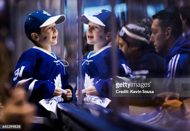 Young fan is reflected in the glass as he watches the Toronto Maple Leafs play the Montreal Canadiens during the first period at the Air Canada...