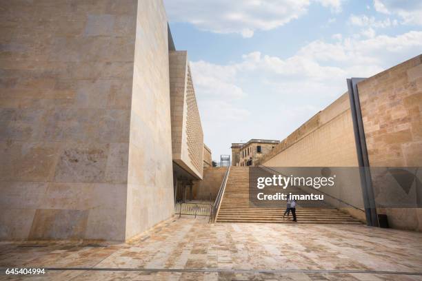 young people hugging on the stairs - modern malta stock pictures, royalty-free photos & images
