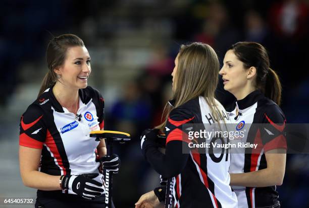 Emma Miskew, Rachel Homan and Lisa Weagle of Ontario talk in a semi final match against Northern Ontario during the 2017 Scotties Tournament of...