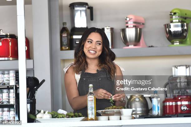 Ayesha Curry gives a cooking demo on stage at Goya Foods' Grand Tasting Village Featuring Mastercard Grand Tasting Tents & KitchenAid Culinary...