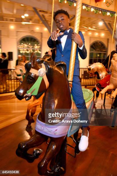 Actor Alex R. Hibbert rides the carousel at the 2017 Film Independent Spirit Awards at the Santa Monica Pier on February 25, 2017 in Santa Monica,...
