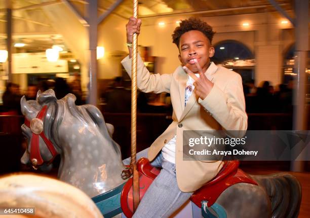 Actor Jaden Piner rides the carousel at the 2017 Film Independent Spirit Awards at the Santa Monica Pier on February 25, 2017 in Santa Monica,...