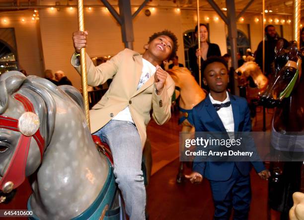 Actors Jaden Piner and Alex R. Hibbert ride the carousel at the 2017 Film Independent Spirit Awards at the Santa Monica Pier on February 25, 2017 in...