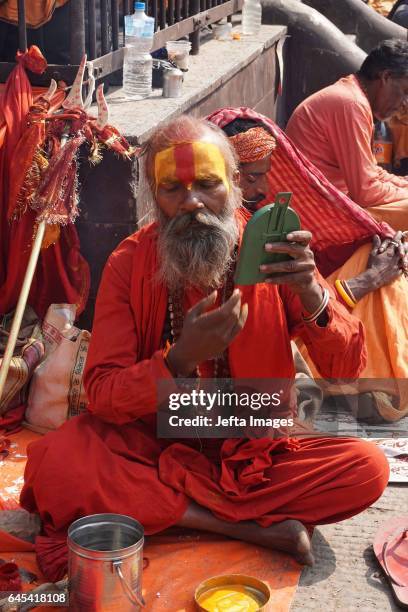 Hindu holy man, or sadhu seen sitting at the premises of Pashupatinath Temple during the Maha Shivaratri festival on February 25, 2017 in Kathmandu,...