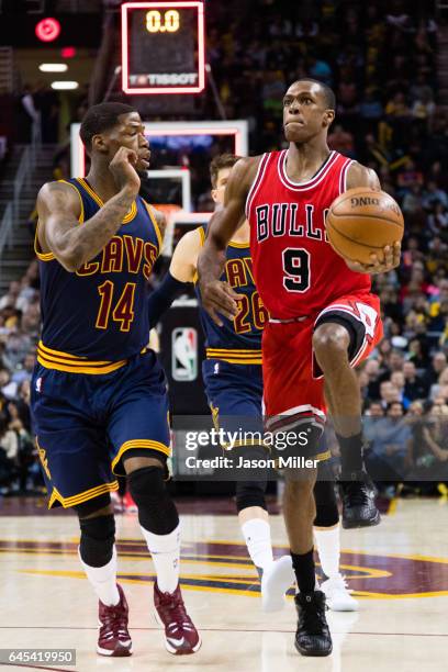 Rajon Rondo of the Chicago Bulls shoots at the third quarter buzzer while under pressure from DeAndre Liggins of the Cleveland Cavaliers at Quicken...