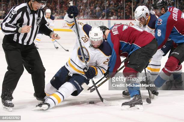 Zemgus Girgensons of the Buffalo Sabres faces off against John Mitchell of the Colorado Avalanche at the Pepsi Center on February 25, 2017 in Denver,...