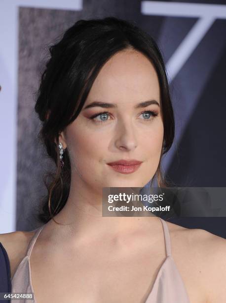 Actress Dakota Johnson arrives at the Los Angeles premiere "Fifty Shades Darker" at The Theatre at Ace Hotel on February 2, 2017 in Los Angeles,...