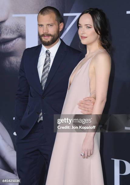 Actor Jamie Dornan and actress Dakota Johnson arrive at the Los Angeles premiere "Fifty Shades Darker" at The Theatre at Ace Hotel on February 2,...