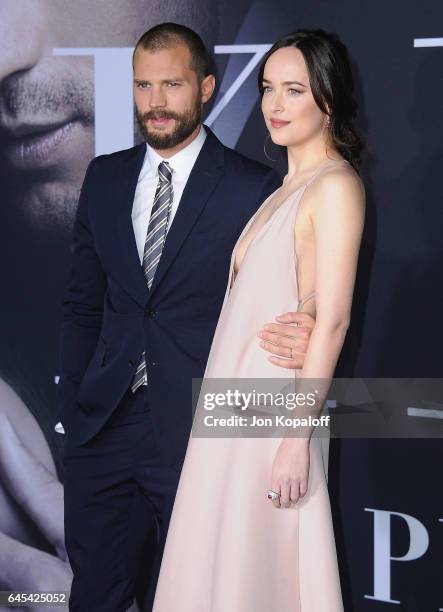 Actor Jamie Dornan and actress Dakota Johnson arrive at the Los Angeles premiere "Fifty Shades Darker" at The Theatre at Ace Hotel on February 2,...