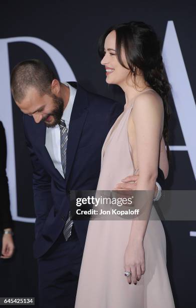 Actor Jamie Dornan and actress Dakota Johnson arrive at the Los Angeles premiere "Fifty Shades Darker" at The Theatre at Ace Hotel on February 2,...