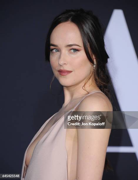 Actress Dakota Johnson arrives at the Los Angeles premiere "Fifty Shades Darker" at The Theatre at Ace Hotel on February 2, 2017 in Los Angeles,...