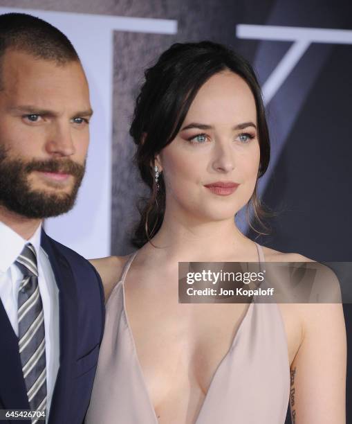 Actor Jamie Dornan and actress Dakota Johnson arrive at the Los Angeles premiere "Fifty Shades Darker" at The Theatre at Ace Hotel on February 2,...