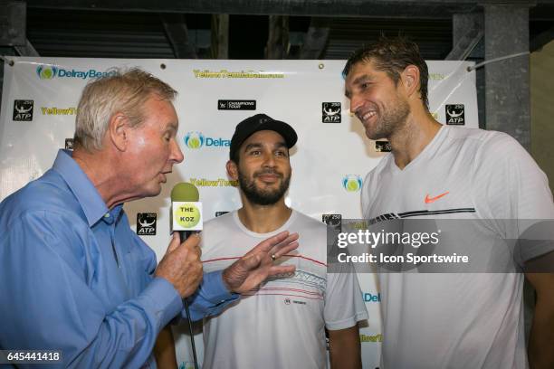 The doubles team of Treat Huey and Max Mirnyi celebrate after defeating Yen-Hsun Lu and Leander Paes during the Doubles Semifinal of the ATP Delray...