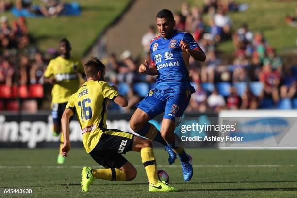 Andrew Nabbout of the Jets collides with Liam Rose of the Mariners during the round 21 A-League match between the Newcastle Jets and the Central...
