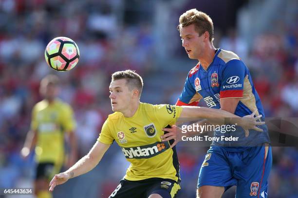Scott Galloway of the Mariners contests the ball with Lachlan Jackson of the Jets during the round 21 A-League match between the Newcastle Jets and...