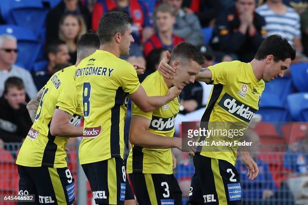 Scott Galloway of the Mariners celebrates his goal with team mates during the round 21 A-League match between the Newcastle Jets and the Central...