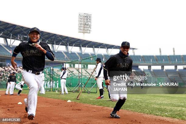 Hayato Sakamoto and Kosuke Tanaka of Japan in action during SAMURAI JAPAN's training camp at the Sun Marine Stadium Miyazaki on February 26, 2017 in...