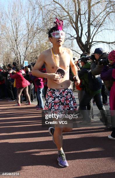 Participants compete in 6th The Pig Run at Olympic Forest Park on February 26, 2017 in Beijing, China.